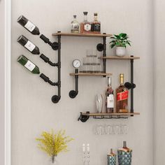 a wall mounted wine rack with bottles and glasses