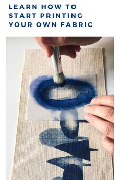 someone using a brush to paint on fabric with the words learn how to start printing your own fabric