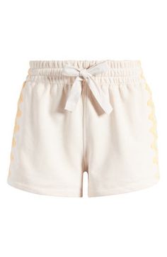 Colorful appliqués and a sweet ribbon fastening the waist add charm points to these casual, cotton-blend shorts. 2 1/2" inseam; 31" leg opening; 14" front rise Drawstring waist 71% cotton, 29% polyester Machine wash, tumble dry Imported Spring Cotton Pajama Shorts With Drawstring, Spring Beige Cotton Pajama Shorts, Beige Cotton Pajama Shorts, Free People Running Shorts, Free People Spandex Shorts, Free People Flirt Shorts, Free People Activewear Shorts, Free People Movement Shorts, Fp Movement