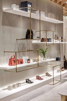 a store with shelves filled with handbags and purses