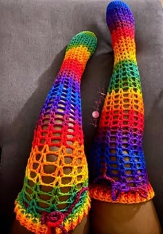 the legs are covered in multicolored crochet