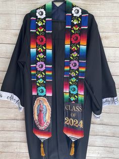 You will receive the exact stole you see on the listing's picture. Its an authentic well made Mexican Serape Graduation Stoles. The serape is handmade delicately with flower embroidery. These stoles are a perfect addition to your graduation outfit. No two stoles are the same. Show off your pride with this unique embroidered stole made by very talented Mexican artisans. These stoles sell out quickly! If you see one you love, purchase it. Message me for express shipping options. Visit my store for full inventory of stoles!   Serape Graduation Stoles, Graduation Stole, Graduation Sash Grad Stoles, Mexican Serapes, Graduation Cap Decoration, Cap Decorations, Butterfly Embroidery