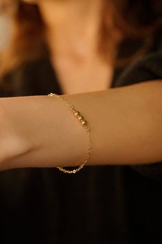 Elevate your style with our stunning Elegance Trio Bracelet, where simplicity meets sophistication in a timeless design. Our bracelet features three meticulously chosen beads that exude understated elegance. Its minimalist design makes it the perfect accessory for any occasion. 14k Gold Filled Bracelet width - 1.4mm Beads - 5mm Extender - 1 inch If you would like a custom length, please don't hesitate to ask. We are more than happy to make one for you. All items come packaged in a gift box ready to give as a gift or keep for yourself. Gold-filled jewellery is a more affordable alternative to solid gold jewellery while still offering a similar appearance and durability. The thick layer of gold provides a long-lasting and tarnish-resistant finish so you can have pieces that will last. Our bo Minimalist Round Bead Bracelets For Party, Elegant Round Bead Bracelets For Birthday Gift, Elegant Round Beads Bracelets For Birthday Gift, Elegant Adjustable Chain Bracelet For Birthday Gift, Elegant Round Beads Bracelet For Birthday Gift, Gold Bracelet With Round Beads For Birthday Gift, Gold Beaded Bracelet For Birthday Gift, Hypoallergenic Chain Bracelet With Round Beads As Gift, Hypoallergenic Round Beads Chain Bracelet As Gift