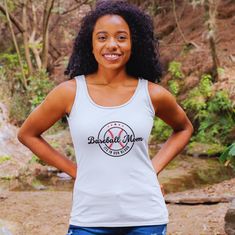 Elevate your wardrobe with our premium "Baseball Mom" tank top! Designed to make a statement, this sleek racerback guarantees to catch attention. Show your pride and support for your favorite player with confidence in this stylish piece! Crafted from extra-light fabric (60% combed, ring-spun cotton and 40% polyester: 4 oz/yd² or 135 g/m this racerback tank is exceptionally lightweight and perfect for an active lifestyle. The classic fit ensures comfort during high-performance activities, while the scooped neckline adds a sporty touch to your ensemble. Plus, for added convenience, all tanks feature a tear-away label for a seamless, scratch-free experience, allowing you to conquer your day with ease. Available in six vibrant colors to match your unique style. See more of our racerback tank t Sporty Racerback Tank Top For Sports Events, Casual Sleeveless Tank Top With Team Name, Sports Racerback Tank Top With Letter Print, Sports Tank Top With Letter Print, Casual Tank Top With Team Name For Sports Events, Casual Sports Tank Top With Team Name, Cotton Racerback Tank Top For Sports Events, Casual Athletic Heather Tank Top For Sports, Team Spirit Racerback Tank Top For Sports Events