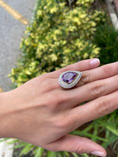 Indulge in the best quality there is with this stunning, high quality amethyst and diamond 18K two-toned ring. A effervescent purple color is evenly distributed in this AAA+ quality gemstone. 15.53cts of pure luster and vivaciousness are set in a gleaming yellow gold bezel. This amethyst is 100% clean to the eye and has the most perfect facets, resulting in a perfect shine. Our 18K gold ring features 1.12cts of perfectly set diamonds with G color and excellent clarity to match, set in white gold Luxury Amethyst Ring With Halo Setting, Purple Multi-stone Amethyst Ring In Fine Jewelry Style, Purple Multi-stone Amethyst Ring Fine Jewelry, Fine Jewelry Purple Amethyst Multi-stone Ring, Luxury Lavender Amethyst Ring With Center Stone, Purple Multi-stone Amethyst Ring, Fine Jewelry White Gold Amethyst Ring With Gemstone Accents, Luxury Lavender Amethyst Ring For Anniversary, Multi-stone Amethyst Ring In White Gold