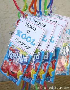 there are some candy bags hanging on the clothes pegs with name tags attached to them