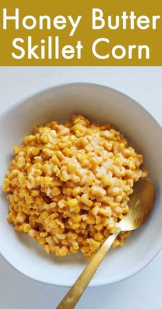 honey butter skillet corn in a white bowl with a spoon