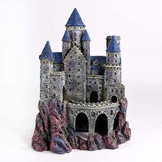 a toy castle made out of clay on a white background