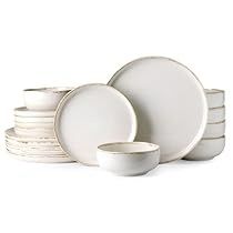 a stack of white plates and bowls on top of each other