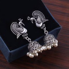 Overview These stylish Jhumka Earrings set from JewelryTrack will certainly leave you spellbound. These Jhumka Earrings set have an excellent finish and gives out an exquisite sense of style. If you are looking for an amazing Fashion Jewelry set for special occasions such as Anniversary, Engagement, Party, Wedding or for gifting , then your search ends here.  Item Description: The look is stunning and preciously suitable for all kinds of dressy occasions. COLOR : Silver  Metal: Brass With Good Quality Silver Plated For - Girls & Women OCCASION: PARTY WEAR , WEDDING, MARRIAGES, CASUAL, DAILY WEAR Ideal For Gifting Care Instruction : Avoid Heat & Chemicals Like perfume, Deo, Alchol, etc and Clean with Dry cotton. Please contact us for Bulk Orders. Seller Info: We are Aiming to supply best pr Oxidized Jhumkas, Indian Rings, Engagement Party Wedding, Amazing Fashion, Fashion Jewelry Sets, Jhumka Earrings, Jewelry Women, Oxidized Silver, Pearl Drop