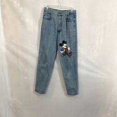 Mickey Mouse Blue Jeans. Jerry Leigh Unlimited Mickey Rapper. Light Washed Jeans. High Waisted Size 11. Great Condition Rare. Has Metal Stamped Mickey Button At Waist. Vintage 80s. Waist 14” Length 40”. Please Check Out The Vintage Mickey Vest In My Closet. Disney Jeans, Micky Mouse Jeans, Light Washed Jeans, Blue Mickey Mouse T-shirt, Old Mickey Mouse Vintage Shirt, Retro Mickey Mouse Crew Neck T-shirt, Mickey Mouse Long Sleeve T-shirt For Streetwear, Jeans High Waisted, Have Metal