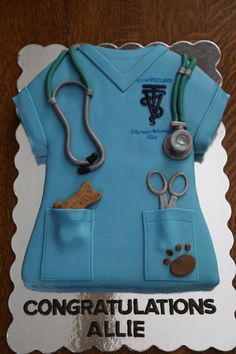 a cake shaped like a nurse's uniform with stethoscopes on it