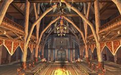 the interior of a large building with wooden beams