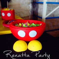 a mickey mouse bowl and some lemons on a table with the name renata party