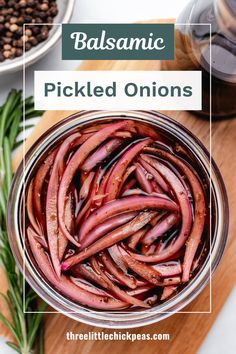 balsamic pickled onions in a glass bowl with rosemary sprigs on the side