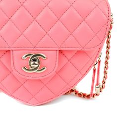 This Chanel Pink Lambskin Mini Heart Bag is in pristine un condition form the 2022 collection. Heart shaped pink lambskin mini bag is quilted in signature Chanel diamond pattern. Front flap pocket with gold interlocking CC twist lock. Top zipper closure with fabric interior. Long leather and chain entwined strap may be comfortably carried across the body. Dust bag included. Measurements: 5.25” x 4.5” x 1.75” drop: 22” Proudly offered from Only s for $10,900.00. Payment by bank wire only. Please email for additional photos of this item. PBF 13224 Chanel Rose, Heart Clutch, Chanel Pink, Chanel Mini, Woven Chain, Pink Chanel, Shopping Chanel, Novelty Bags, Heart Bag