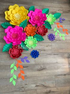 colorful paper flowers laid out on the floor