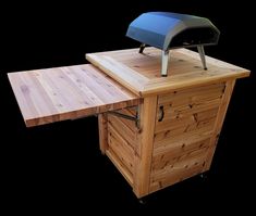 a wooden table with a grill on top