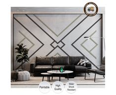 the living room is decorated in black and white with geometric designs on the wall behind it