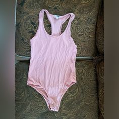 Pink Fashion Nova Tank Bodysuit Never Worn Summer Scoop Neck Loungewear Bodysuit, Summer Scoop Neck Bodysuit For Loungewear, Summer Bodysuit For Loungewear, Scoop Neck Bodysuit For Summer Loungewear, Chic Pink Bodysuit For Loungewear, Summer Stretch Bodysuit With Scoop Neck, Casual Scoop Neck Summer Bodysuit, Casual Sleeveless Leotard, Pink Bodysuit For Summer Loungewear