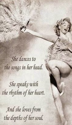 a woman in a feathered dress is dancing with her arms outstretched and the words she dances