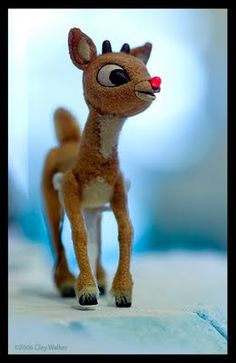 a close up of a toy deer on a table