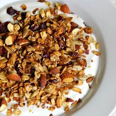 yogurt and granola in a bowl on a white plate