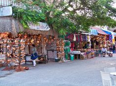 an outdoor market with lots of items for sale