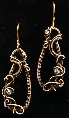 these beautifully handmade curly's will definitely impress! They will stand out in any crowd. They are made of copper and have sparkling beads that add a hint of glimmer to catch the eye! A great gift for birthdays, anniversary, holidays and any occasion! These earrings are made to order and ship within 2-3 business days. Bronze Wire Wrapped Hoop Earrings, Handmade Copper Earrings For Party, Copper Dangle Crystal Earrings For Gift, Copper Beaded Teardrop Earrings For Gifts, Teardrop Copper Beaded Earrings For Gift, Hand Forged Copper Dangle Hoop Earrings, Hand Forged Copper Hoop Earrings With Dangle, Unique Copper Wire Wrapped Hoop Earrings, Bronze Wire Wrapped Drop Earrings