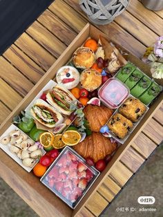 a wooden table topped with lots of different types of food