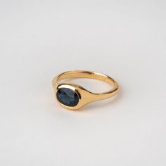 A precious central sapphire in an oval structure ✦ Material ✦ 18k yellow solid gold ✦ Details ✦ Stone: natural (untreated) blue sapphire 1.9 ct Shape: oval faceted or cabochon stone (you can choose) Bezel width: 8 mm Band width: 2.3 mm - Please note Each gemstone can look a little different, there is a range of tones for natural stones. Slight changes in shape and color may occur. All of our items are meticulously made in our studio in HaYogev. Manufacturing time takes 10-20 days. Ring Size This Gold Ring With Colored Stones, Gold Sapphire Ring Oval Cabochon With Polished Finish, Gold Ring Blue Stone, Elegant Oval Sapphire Signet Ring, Elegant Sapphire Oval Signet Ring, Modern Oval Sapphire Ring With Polished Finish, 14k Gold Oval Sapphire Ring Hallmarked, Oval Yellow Gold Sapphire Ring With Gemstone, Oval Yellow Gold Sapphire Ring