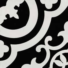 a black and white wall with an ornate design