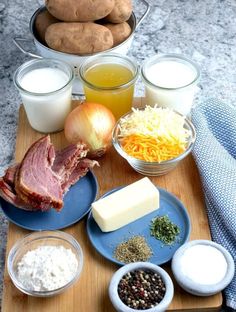 a wooden cutting board topped with different types of food