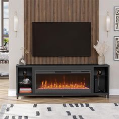 a living room with a television and fire place in the center, along with a rug on the floor