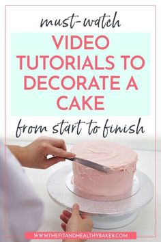 someone is decorating a cake with pink frosting and the words must watch video videos to decorate a cake from start to finish