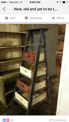 an old wooden shelf with many boxes on it and a ladder leaning against the wall