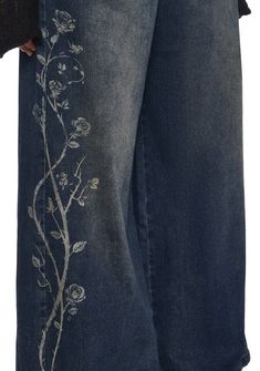 These pants have a denim construction, a wide leg silhouette, an airbrushed rose design on the sides, front and back pockets, and a front button and zipper closure. Jeans With Lace Bottoms, Cool Jeans Design, Karakuri Jeans, Bleach Jeans, Bleach Shirt Diy, Bleach Shirt, Rose Graphic, Shirt Diy, Painted Clothes