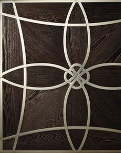 a close up view of a wooden door with metal designs on the front and sides