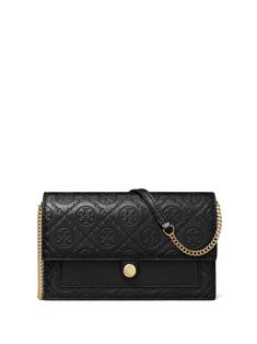 black leather debossed monogram pattern foldover top with magnetic fastening adjustable detachable shoulder strap multiple internal slip pockets T Monogram, Monogram Pattern, Tory Burch, Clutch Bag, Shoulder Strap, Black Leather, Monogram, Wallet, Leather