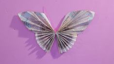 an origami butterfly made out of money