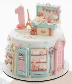 a cake decorated to look like a baby's first birthday