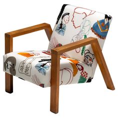 an upholstered chair with wooden frame and colorful fabric