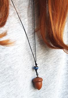 Handmade pendant  with natural acorn, which was picked right after it fall off of the oak tree. It was allowed to dry, cleaned and gently attached to the cap. Also, I added some colorful beads to give it a special touch. The pendant has a black thread chain to carry on your neck. The thread is 40 cm length (if you want to get a longer thread, please let me know and I will add an extra length). This forest necklace will always keep a piece of my touch. It will gently adorn your neck and hold warm wishes inside. It could be worn as a talisman to keep you safe, attract success and love; The acorn necklace can be a real treasure for all nature lovers; It is really cute, pretty little thing and I hope you will enjoy this talisman as much as I have had to create it ♥ DIMENTIONS & SPECIFICS: ▶MAT Peter Pan Jewelry, Oak Acorn, Acorn Jewelry, Forest Necklace, Necklace With Beads, Thread Chains, Acorn Crafts, Acorn Pendant, Mushroom Jewelry