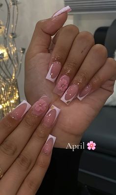 a woman's hand with pink and white nails