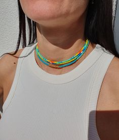 Looking for a unique and colorful addition to your jewelry collection? Look no further than our stunning mixed bead bright color necklace! Featuring a rainbow of vibrant colors and delicate seed beads, this necklace is the perfect statement piece to add some fun and flair to any outfit. The adjustable length allows for comfortable wear, and the versatile style makes it perfect for layering with other necklaces or wearing on its own as a bold statement. This seed bead choker is the ultimate acces Mixed Bead Necklace, China Fashion Week, Mixed Beads Necklace, Pride Necklace, Layering Jewelry, Bead Choker, Color Necklace, Rainbow Beads, Layered Jewelry