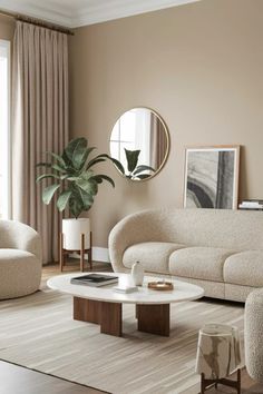 a living room with two couches and a coffee table in front of a window