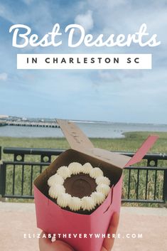 someone holding up a box with some food in it and the words best desserts in charleston sc