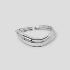 Our wave hinged bangle has a simple click closure & features a fluid, tapered design with a seamlessly sleek finish. Made with Rhodium plated recycled brass. Outside diameter 75mm x 72mm.  Inside diameter 67mm x 57 mm. Luxury Handmade Silver Bangle, Statement Cuff Bracelet, Gold And Silver Bracelets, The Bangles, Silver Bangle, Hinged Bangle, Body Jewellery, Silver Bangles, Bracelet Gift