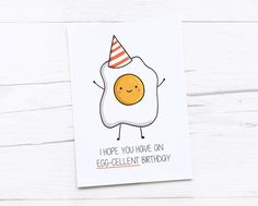 a card with an egg wearing a party hat