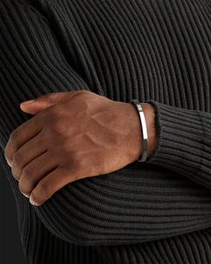 Whether you're looking for a traditional look or something newer, this cuff for men is a timeless piece of jewelry that you can wear for official events and everyday life.When choosing a men's jewel, ensure the style and material match your outfit. Choosing a comfortable men's bracelet is essential in ensuring it fits perfectly.Their exteriors and minimal shape allow the precious metal plating to shine through. You can wear them alone or with other minimal accessories with similar tones. This is the perfect piece to accessorize your wardrobe. Metal: 925 Sterling Silver / 24k Gold Plated / Rhodium over 925 Sterling Silver Dimensions: 6 mm W One Size Fits Most The cuff can open and close, is a malleable metal and carefully can adjust to your wrist. Type: Cuff 100% Handcrafted Package: High q Mens Wrist Accessories, Silver Bracelet For Men Design, Men Bracelet Silver, Men Silver Bracelet, Mens Accessories Bracelet, Mens Cuff Bracelets, Mens Bracelets, Minimal Accessories, Mens Bracelet Silver